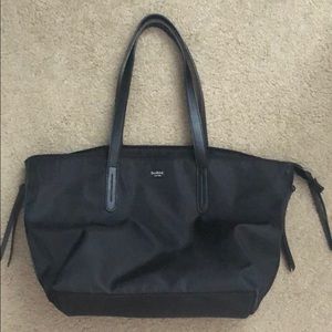 A large black zipper shoulder bag
